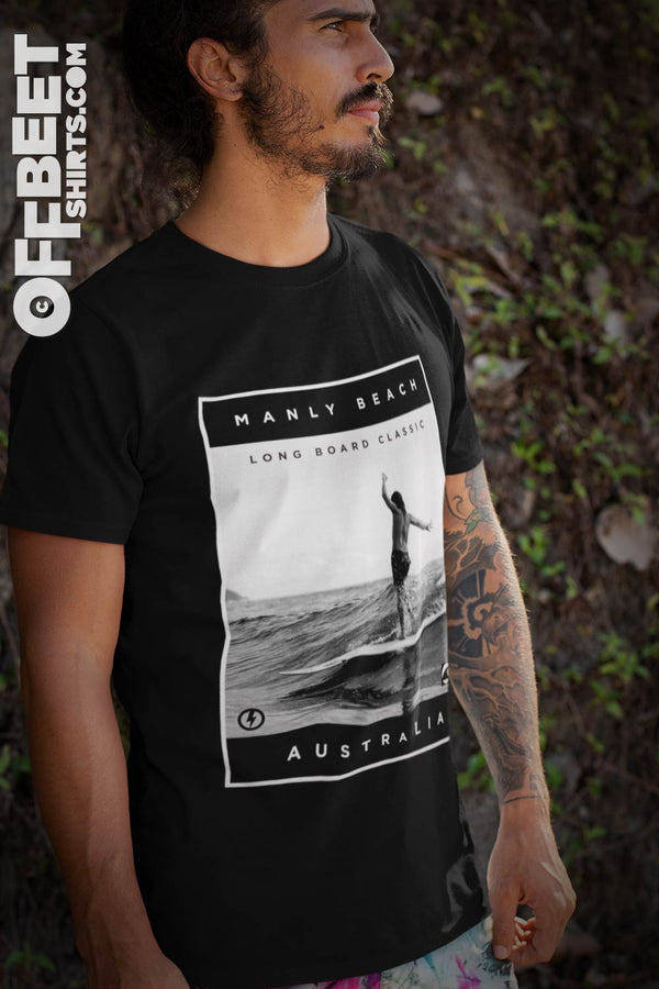 Manly long board classic No.1 Surf Men’s Graphic T-shirt. World famous Manly Beach Australia. Monotone graphic person an a wave old school Longboard. Mens white t-shirt  I  © 2019 Offbeet Shirts original design
