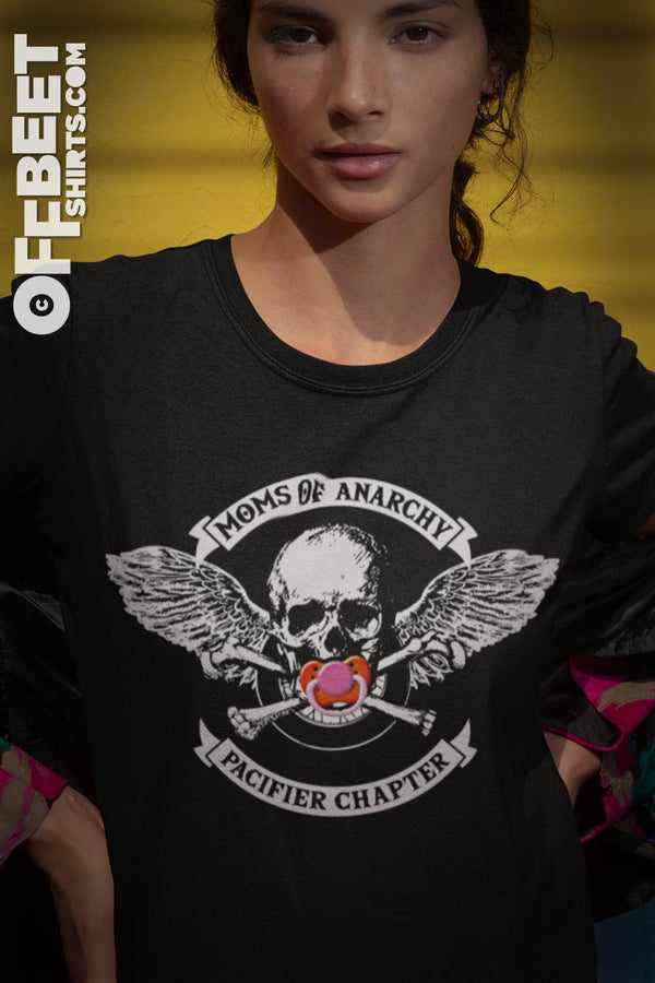 MOMS OF ANARCHY, PACIFIER CHAPTER FUNNY Woman's GRAPHIC T-SHIRT shows pacifier over skulls mouth, skull and cross bones motobike wheel and angels wings