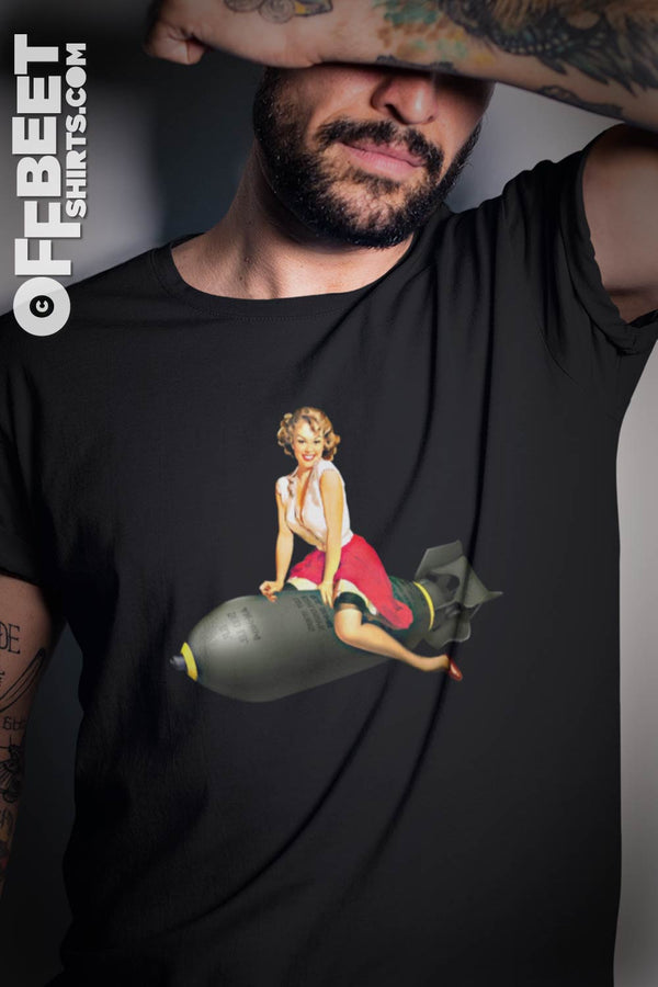 Bombs away retro Men’s Graphic T-shirt. Classic retro style of women straddled over a large bomb. Mens black t-shirt.  I  © 2019 Offbeet Shirts original design