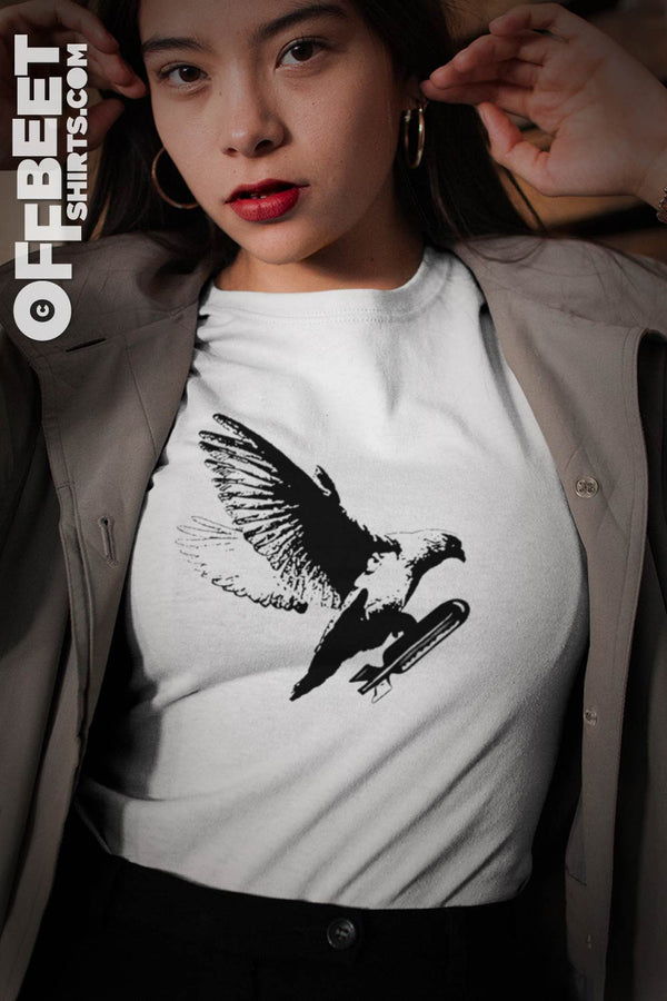 Dove Bomb Women’s Graphic T-shirt. Black graphic of Dove about to drop a bomb. Womens white t-shirt  I  © 2019 Offbeet Shirts original design